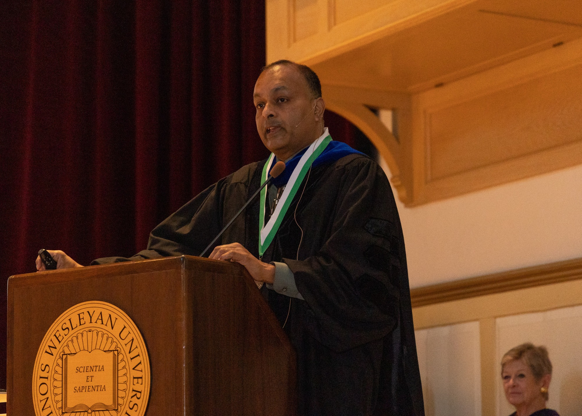 Ram Mohan presents from podium during Kemp Award ceremony