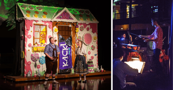 hansel and gretel on stage in front of candy cottage with orchestra conductor