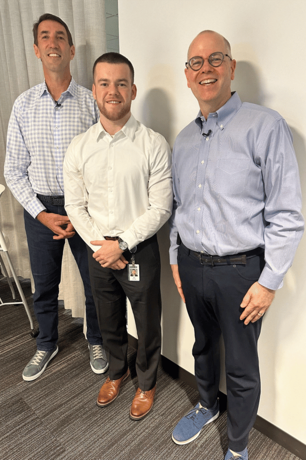 Student Will McNulty with Country Financial executives Jim Jacobs and Rob McDade