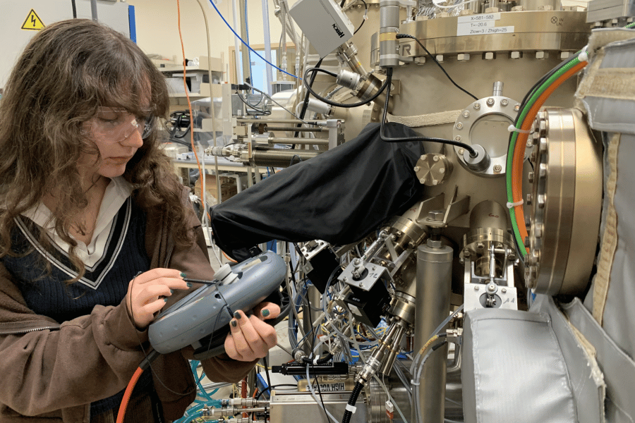 Wanda Lindquist controls the movement of a sample inside a molecular beam epitaxy machine at Argonne National Laboratory