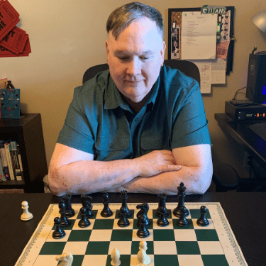 Robert Irons with Chess Board