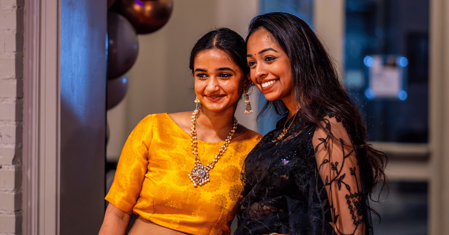 Two students pose in Hansen Student Center during the 2024 Unity Gala at Illinois Wesleyan